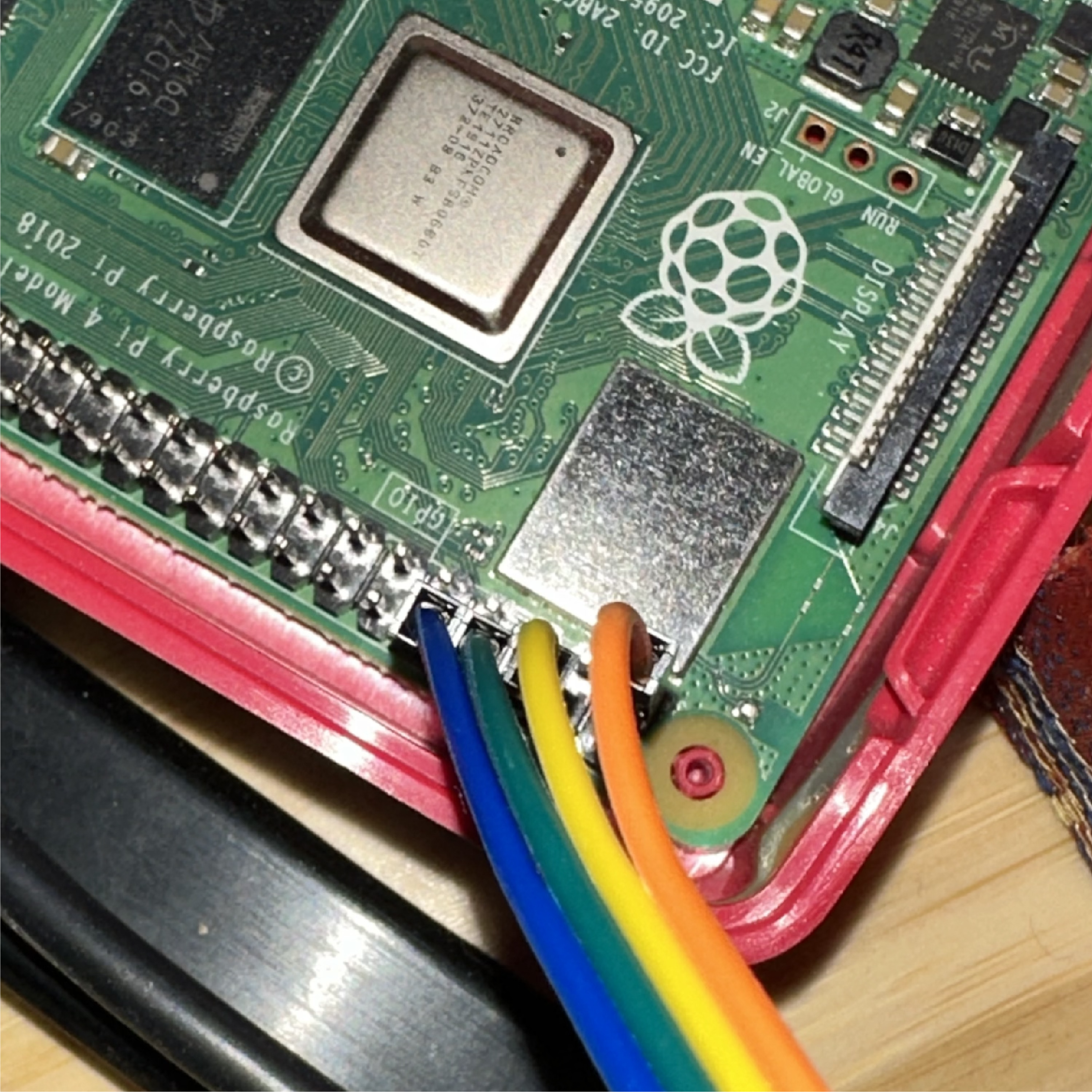 Jumper wires on GPIO pins 1, 6, 8, and 10.